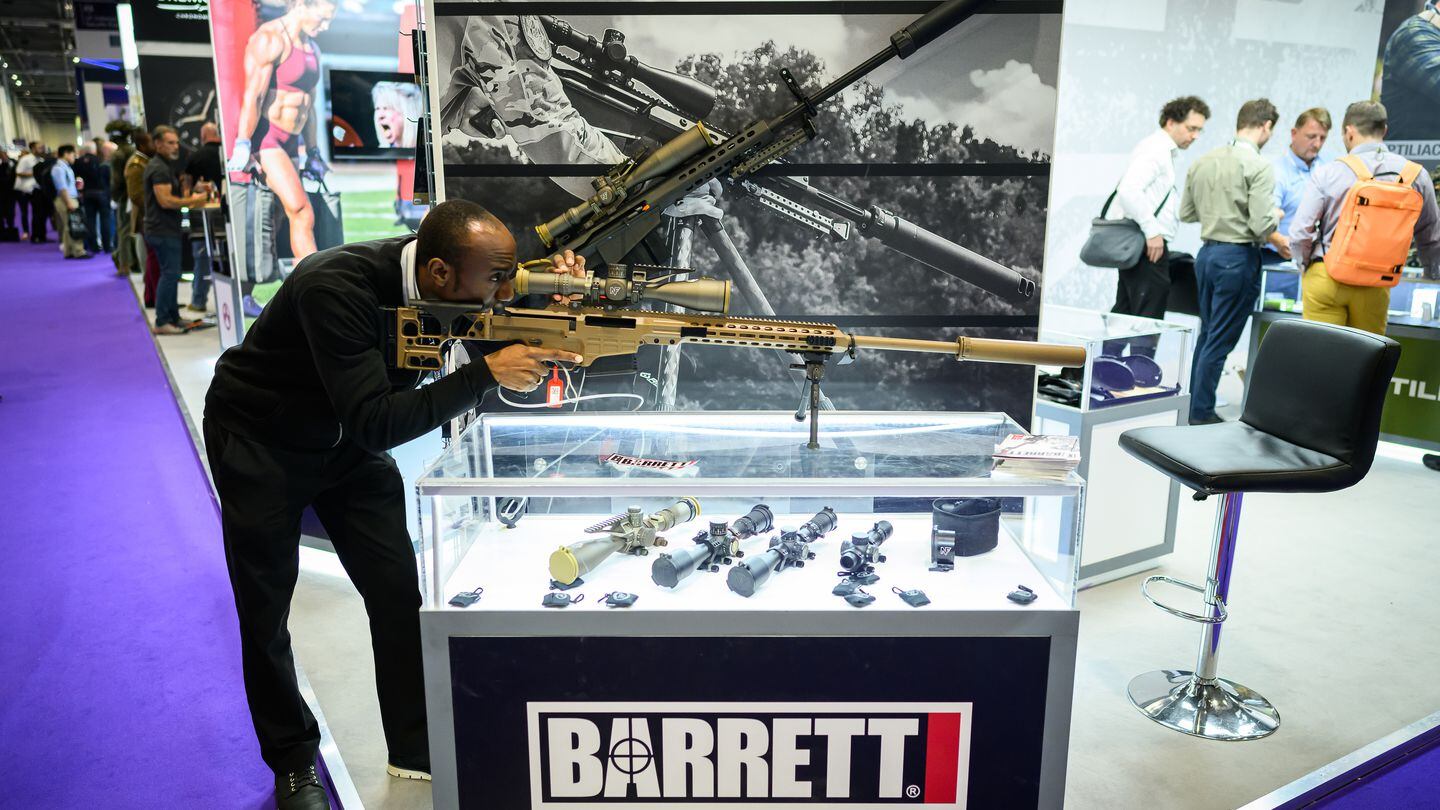 A DSEI visitor tests a Barrett MRAD rifle at the London-based ExCel convention center on Sept. 13, 2023. (Leon Neal/Getty Images)