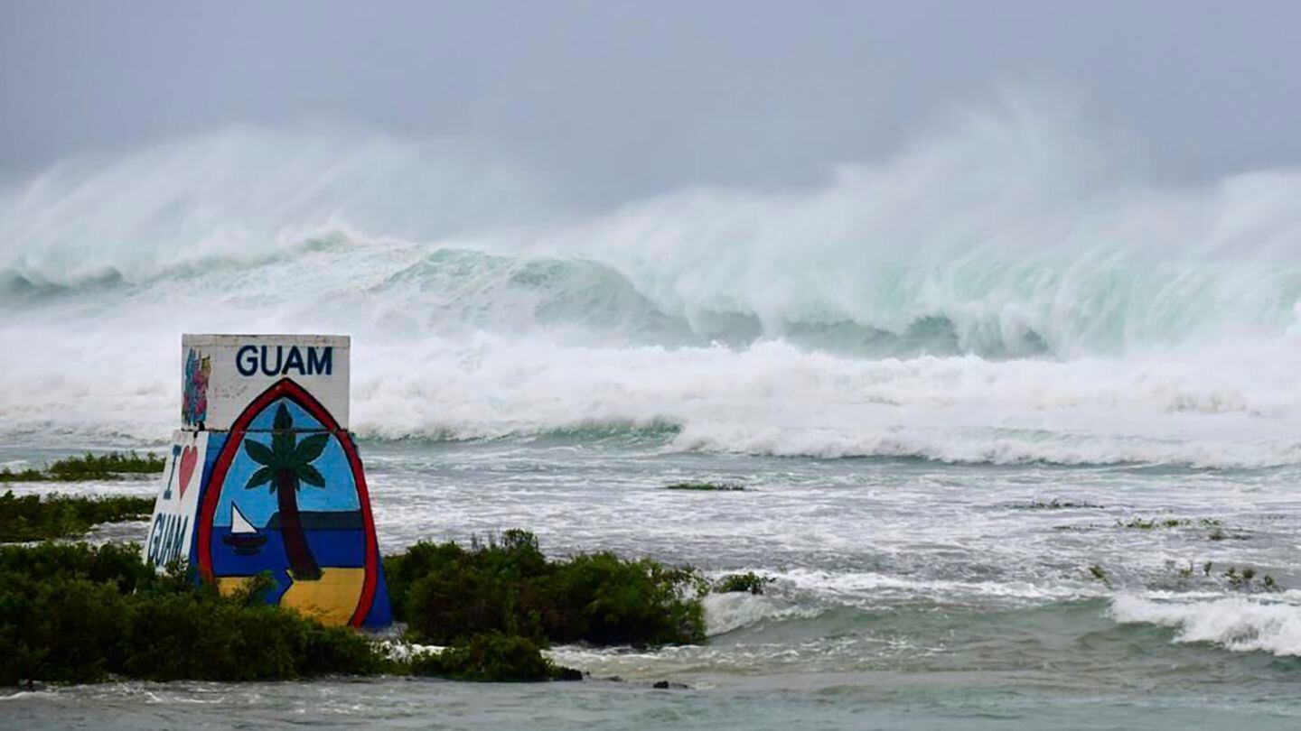 High waves from Typhoon Mawar batter the coast of Ipan in Talofofo, Guam, Wednesday. Many residents remain without power and utilities. The storm ripped roofs off homes, flipped vehicles and shredded trees. (Rick Cruz/The Pacific Daily via AP)
