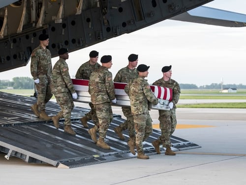 A U.S. Army carry team transfers the remains of Spc. Miguel L. Holmes, of Hinesville, Ga., May 9, 2019, at Dover Air Force Base, Del. (Senior Airman Christopher Quail/Air Force)