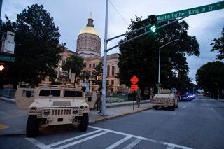 Members of the Georgia National Guard stand outside the State Capitol on July 7, 2020, in Atlanta.