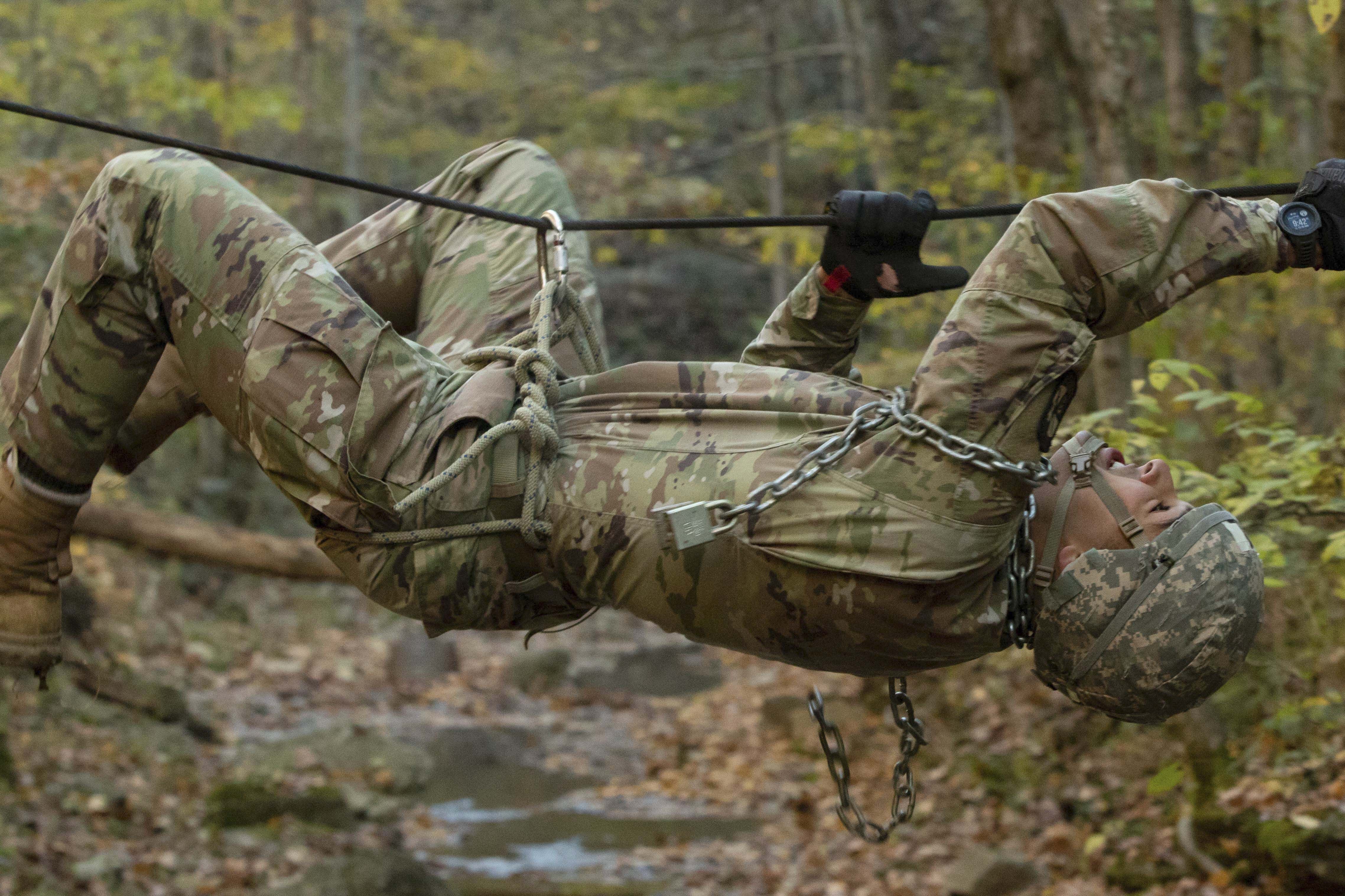 Army Cadet Robbie Pinto maneuvers across a creek during a competitive event at Fort Knox, Ky., Nov. 6, 2021. (Sarah Windmueller/Army)