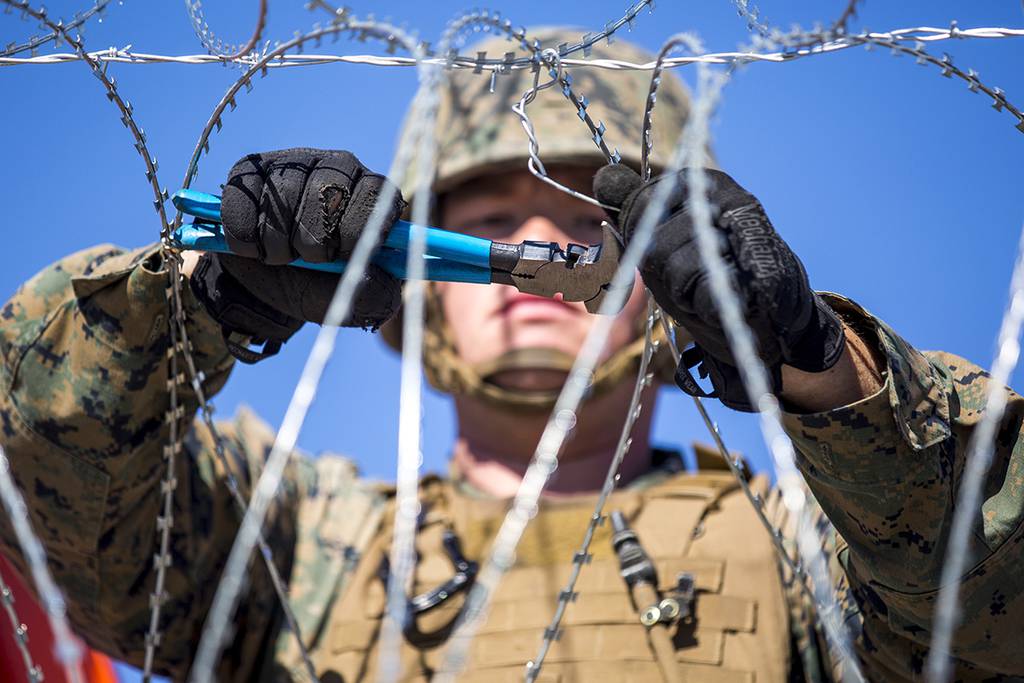 Razor wire is most visible result of 210M troop deployment to the US