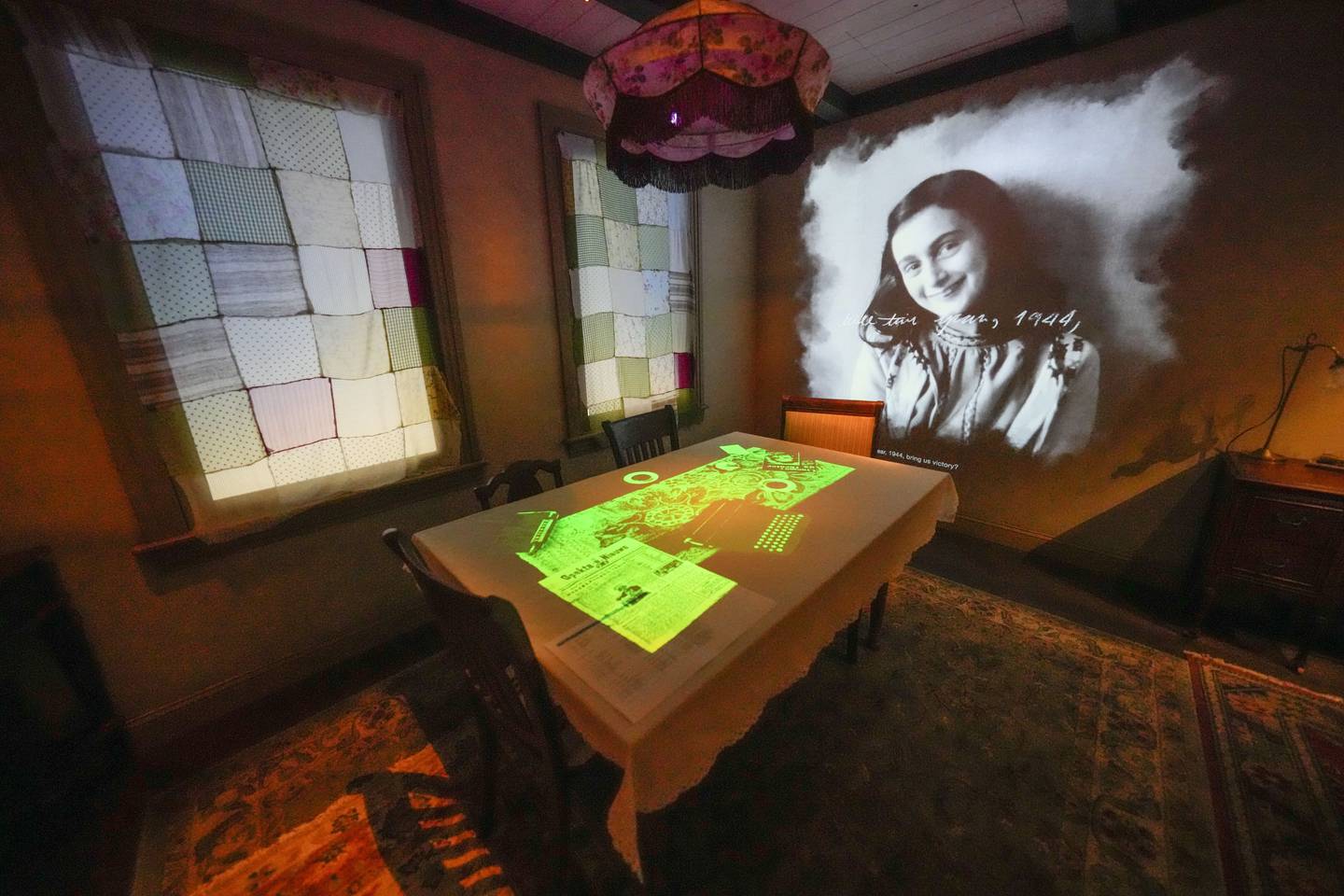 A portrait of Anne Frank is part of a replica of the home in Amsterdam where she hid, as part of the new pavilion opening at the National World War II Museum in New Orleans, Tuesday, Oct. 31, 2023.
