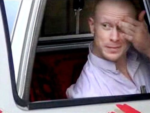 FILE - In this file image taken from video obtained from Voice Of Jihad Website, which has been authenticated based on its contents and other AP reporting, Sgt. Bowe Bergdahl, sits in a vehicle guarded by the Taliban in eastern Afghanistan. A one-year travel ban is expiring for five senior Taliban leaders held in U.S. detention at Guantanamo Bay until they were released last year in exchange for Bergdahl, who was held captive by the Taliban for nearly five years after he walked away from his Army post in Afghanistan. (AP Photo/Voice Of Jihad Website via AP video, File)