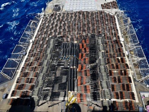 Weapons that the U.S. Navy described as coming from a hidden arms shipment aboard a stateless dhow are seen aboard the guided-missile cruiser USS Monterey on May 8, 2021. (U.S. Navy via AP)