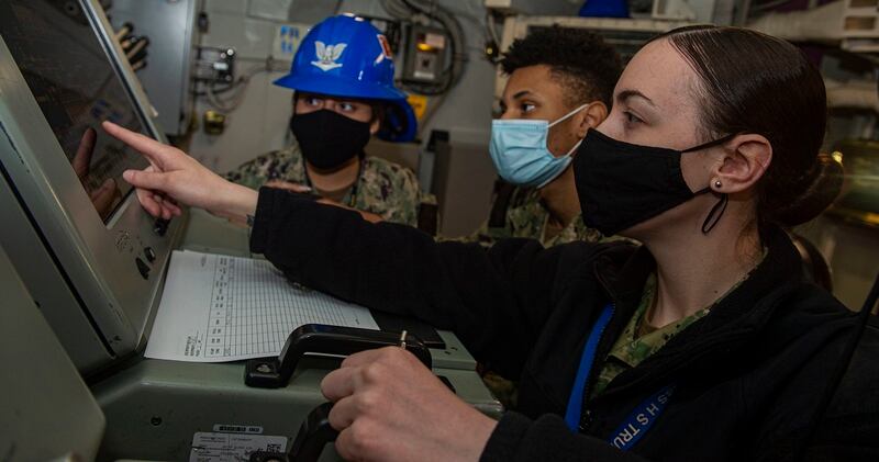 Aviation Boatswain's Mate (Fuel) 3rd Class Deanna Akins, right, trains ABF3 Adrianna Sanchez and Xavier Wiley on JP-5 jet fuel system operations in a pump room aboard the carrier Harry S. Truman April 20. (MCSN Tyler Cardoza/Navy)