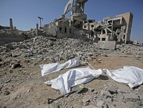 Bodies covered in plastic lie on the ground amid the rubble of a Houthi detention center destroyed by Saudi-led airstrikes, that killed at least 60 people and wounding several dozen Sept. 1, 2019, according to officials and the rebels' health ministry, in Dhamar province, southwestern Yemen. (Hani Mohammed/AP)