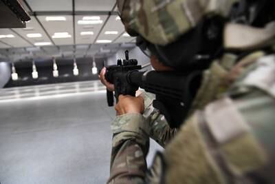 Soldiers fire the M4 carbine during marksmanship training at the indoor range Caserma Del Din, Vicenza, Italy, July 9, 2020.