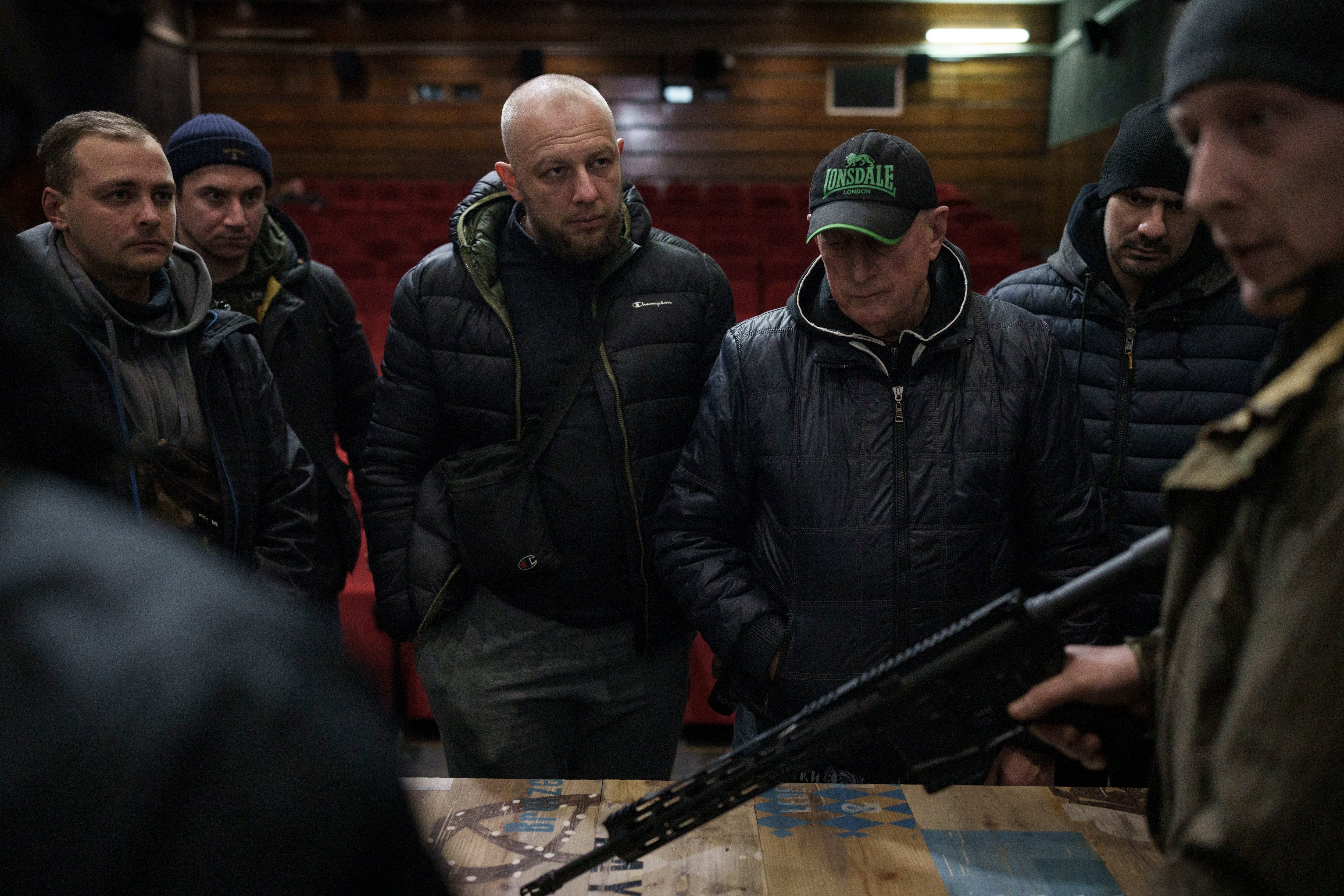 Ukrainian civilians receive weapons training inside a cinema in Lviv, western Ukraine, Saturday, March 5, 2022. (Felipe Dana/AP)