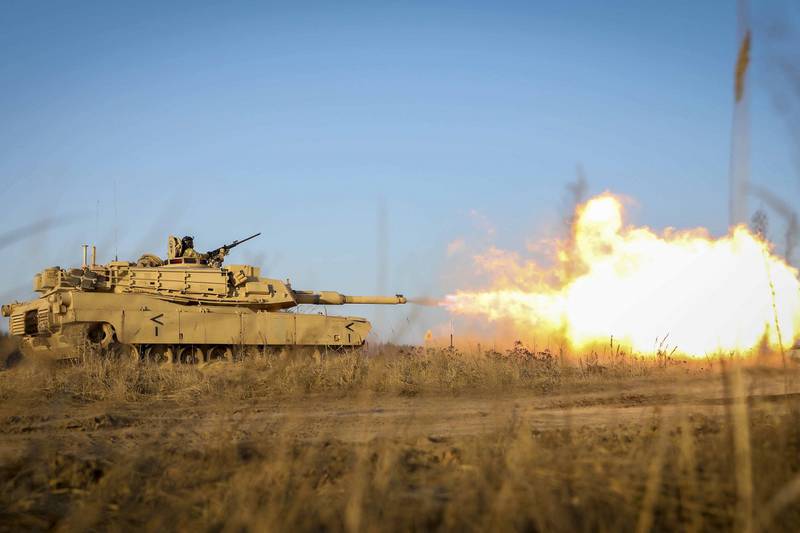 Gasses ignite as an M1 Abrams tank fires its main gun during a Dec. 10, 2020, live fire as part of the Ready to Fight operations after arriving to the Pabrade Training Area, Lithuania.