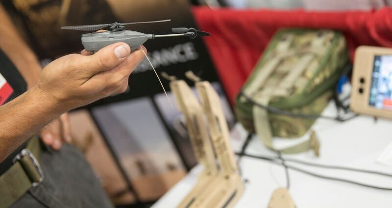 A Prox Dynamics employee shows off their nano-UAV, the PD-100 Black Hornet personal reconnaissance system at the Modern Day Marine expo at Marine Corps Base Quantico in Quantico, Va., on Tuesday, September 22, 2015.