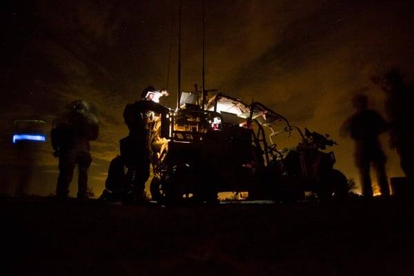 Marines with Marine Special Operations Company Charlie, 1st Marine Raider Battalion, U.S. Marine Corps Forces, Special Operations Command, process intelligence and set up a visual telecommunication feed after a simulated direct-action night raid during a company level exercise along the state line between Arizona and California, Oct. 20, 2015. (Cpl. Steven Fox, Marine Corps)