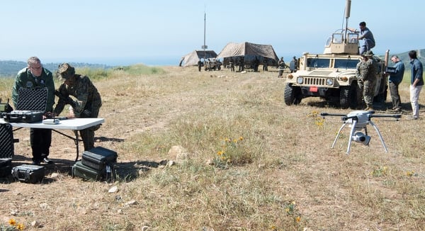 Noting the need to process drone footage quickly, Deputy Secretary of Defense Bob Work (left) sent a memo not long after this picture was taken establishing an Algorithmic Warfare Cross-Functional Team to develop AI tools sought by the Pentagon. (Staff Sgt. Jette Carr/Air Force)