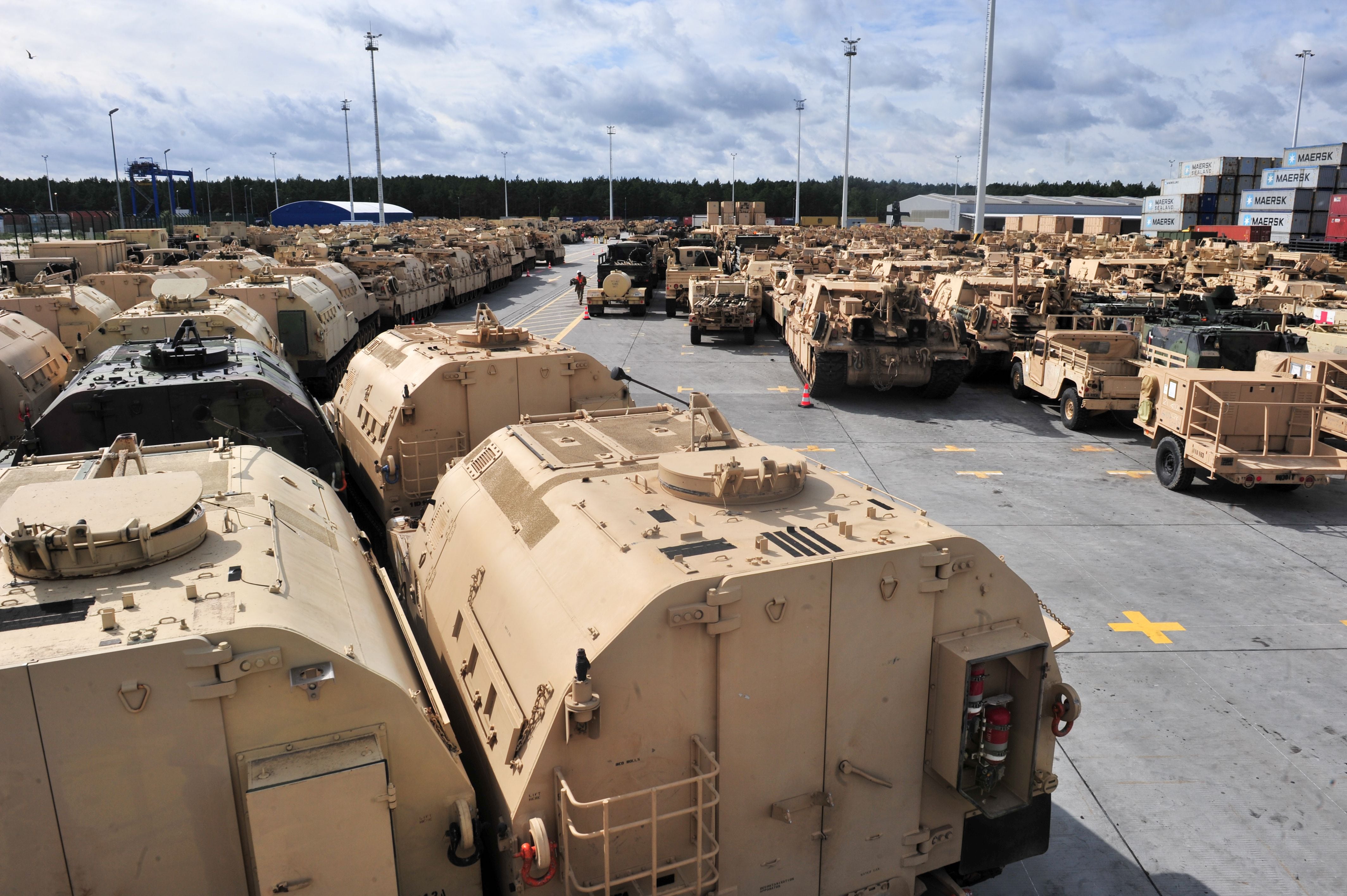 More than 1,000 pieces of eqiuipment, including M1 Abrams tanks, Paladin self-propelled howitzers, wheeled vehicles and other equipment from 2nd Armored Brigade Combat Team, 1st Infantry Division, out of Fort Riley, Kansas, lines the port in Gdansk, Poland, Sept. 14, 2017, as the unit prepares to move its equipment inland. (Sgt. 1st Class Jacob A. McDonald/Army)
