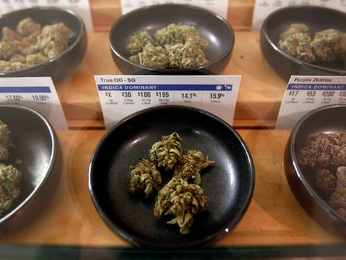 Different types of marijuana sit on display at Harborside in Oakland, Calif. The military is grappling with whether past marijuana use, particular in places where it's legal, should bar someone from joining. (Mathew Sumner/AP)