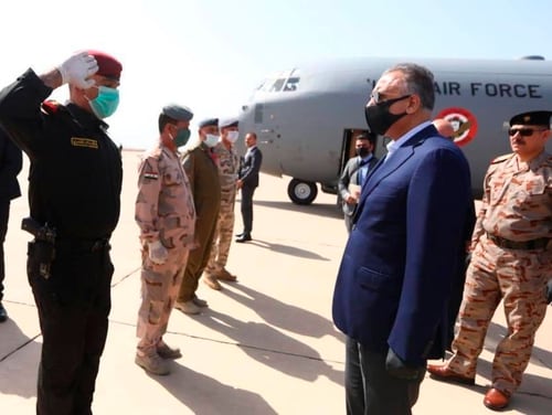 Iraqi Prime Minister Mustafa al-Kahdimi, right, arrives to Mosul, Iraq, Wednesday, June 10, 2020. (Iraqi Prime Minister Media Office, via AP)