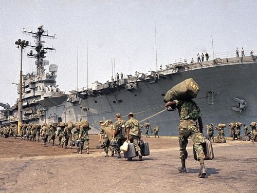 U.S. Marines prepare to board ship at Danang in 1970 for trip back to U.S. under withdrawal orders. On Tuesday, a federal court ordered VA to award presumptive disability benefit status to thousands of Vietnam veterans who served on ships in the waters around that country. (AP Photo)