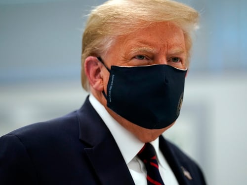 President Donald Trump and first lady Melania Trump have tested positive for the coronavirus, the president tweeted early Friday. (Evan Vucci/AP)