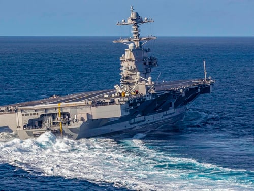 The aircraft carrier Gerald R. Ford conducts high-speed turns in the Atlantic Ocean in November. Ford was at sea conducting sea trials following the in port portion of its 15 month post-shakedown availability. (Navy)
