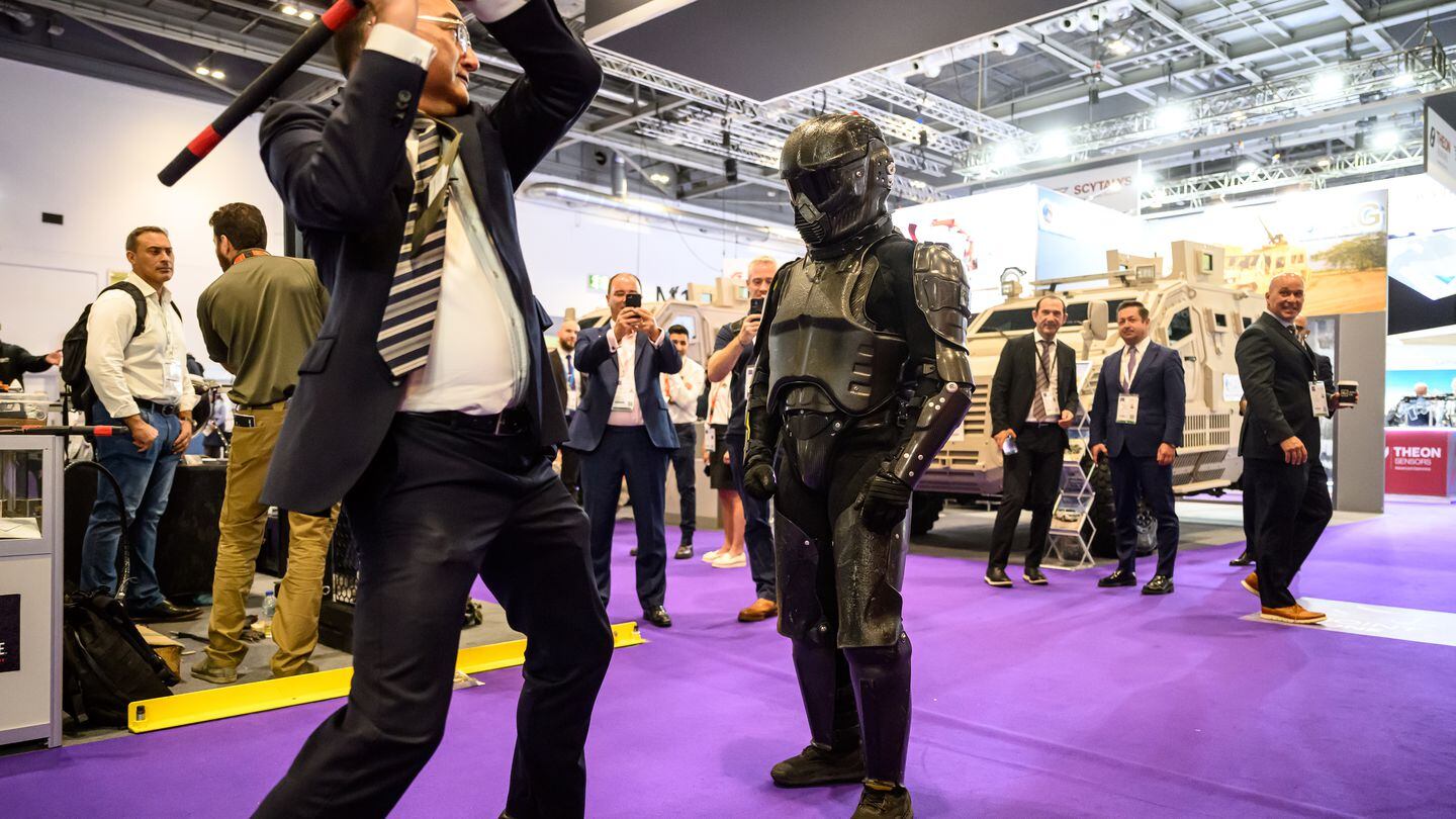 A man wearing a Chiron-X1 high-impact, close-quarter fighting training suit is attacked by a member of the sales team during a demonstration on the first day of DSEI 2023. (Leon Neal/Getty Images)