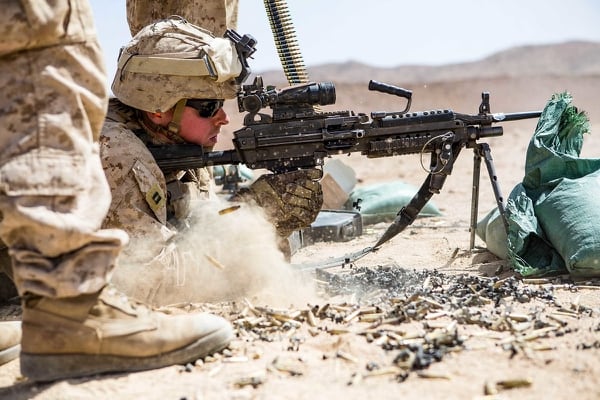 Marine Capt. Jeffery Wuebolt, executive officer, Weapons Company, Battalion Landing Team, 2nd Battalion, 6th Marine Regiment, 26th Marine Expeditionary Unit, fires an M249 Squad Automatic Weapon. (Lance Cpl. Tojyea G. Matally/Marine Corps)
