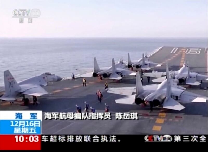 In this image taken from a video footage run by China's CCTV via AP Video, China's aircraft carrier Liaoning is seen during live-ammunition drill recently in the waters of the Bohai Sea in northern China. China's first aircraft carrier battle group has carried out its first live-fire exercise, the Defense Ministry has announced. (CCTV via AP Video)