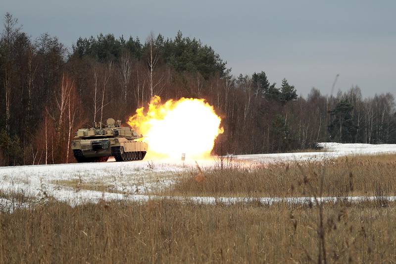 An M1 Abrams Main Battle Tank assigned to the 2nd Battalion, 5th Cavalry Regiment, 1st Armored Brigade Combat Team, 1st Cavalry Division, fires its main gun at Grafenwoehr Training Area, Germany, Dec. 2, 2020.