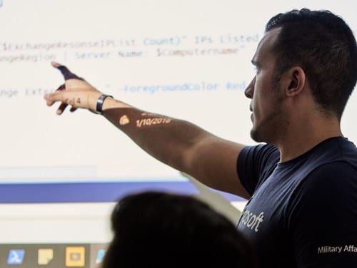 Microsoft Military Affairs launches its Tech Transition Toolkit for veterans looking to get into technology careers. Joey Cruz, pictured, senior program manager at Microsoft, leads a 2018 class for Microsoft Software and Systems Academy, which shifted from in-person to virtual learning in March 2020 because of the pandemic. (Garland Cary/Microsoft)
