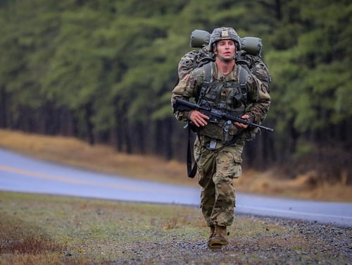 New Jersey Army National Guard Sgt. Michael Henri runs through misty weather during the 12-mile ruck march portion of the 2018 New Jersey National Guard Best Warrior competition. (Master Sgt. Matt Hecht/Air Force)