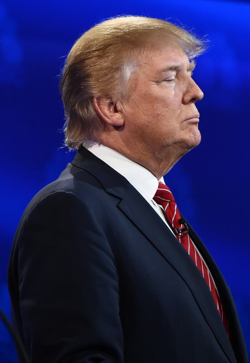 Republican presidential hopeful Donald Trump waits for the start of the CNBC Republican Presidential Debate, October 28, 2015 at the Coors Event Center at the University of Colorado in Boulder, Colorado. AFP PHOTO / ROBYN BECK