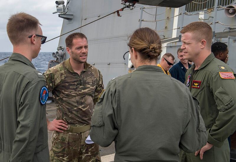 The crew of the “Warlords” of Helicopter Maritime Strike Squadron 51 welcomed aboard Royal Navy Pilot Lt. Mark Hoar from the Type 23 ‘Duke’ Class guided-missile frigate Argyll on the flight deck of the guided-missile destroyer McCampbell on Jan. 14. (Mass Communication Specialist 2nd Class John Harris/Navy)