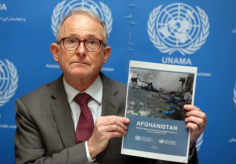 Richard Bennett, United Nations Assistance Mission in Afghanistan (UNAMA) Human Rights Director holds a copy of the U.N. 2018 Annual Report on the Protection of Civilians in Armed Conflict in Afghanistan, during a press conference in Kabul, Afghanistan, Sunday, Feb. 24, 2019. The United Nations Assistance Mission in Afghanistan said 10,993 civilians were killed or wounded last year, the highest number since the international organization began tallying figures in 2009. (Rahmat Gul/AP)