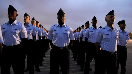 Basic trainees yell out their squadron's motto before the basic trainees graduate at Lackland Air Force Base, Texas. (U.S. Air Force photo/Staff Sgt. Desiree N. Palacios)
