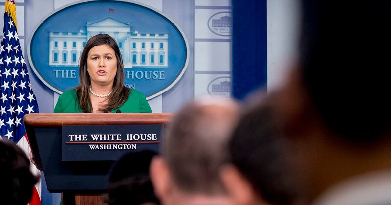 White House press secretary Sarah Huckabee Sanders reads a statement from President Donald Trump announcing that he will remove the security clearance from former CIA Director John Brennan during the daily press briefing at the White House, Wednesday, Aug. 15, 2018, in Washington. Sanders said the president will be reviewing the security clearances for a number of other former officials. (Andrew Harnik/A{)