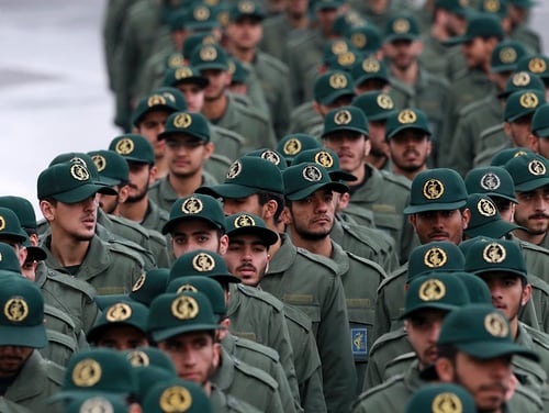 How would Iran's military fare in an armed conflict with the U.S.? In this Feb, 11, 2019, file photo, Iranian Revolutionary Guard members arrive for a ceremony celebrating the 40th anniversary of the Islamic Revolution, at the Azadi, or Freedom, Square, in Tehran, Iran. (Vahid Salemi/AP)