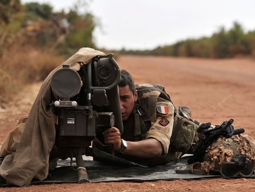 A French soldier lays with a Milan anti-tank missile launcher at the forward position near Diabaly, Mail, on Jan. 22, 2013. (Issouf Sanogo/AFP via Getty Images)