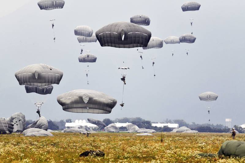 U.S. Army paratroopers descend onto Juliet Drop Zone after exiting a U.S. Air Force C-130 Hercules aircraft during airborne operations at Pordenone, Italy, Oct. 1, 2020.