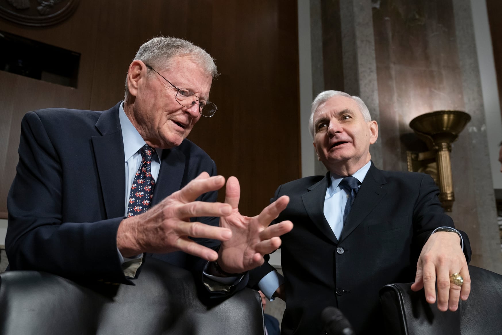 Senate Armed Services Committee Chairman Jim Inhofe, R-Okla., left, and ranking member Sen. Jack Reed, D-R.I., confer before a hearing on the Pentagon budget on March 14, 2019. (J. Scott Applewhite/AP)