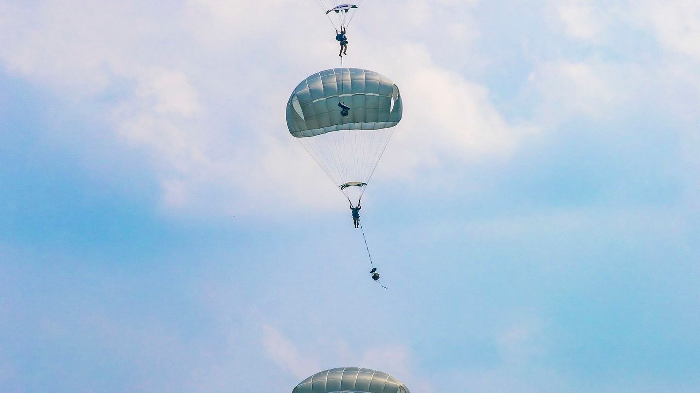 U.S. Army soldiers and Indonesia airborne troops conduct a joint forcible entry operation at Baturaja Training Area on Aug. 4, 2021. (Staff Sgt. Thomas Calvert/U.S. Army)