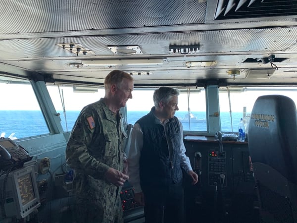 Adm. James Foggo, left, chats with U.S. Ambassador to Russia Jon Huntsman aboard the aircraft carrier Abraham Lincoln on April 23, 2019. (Matthew Bodner/Staff)