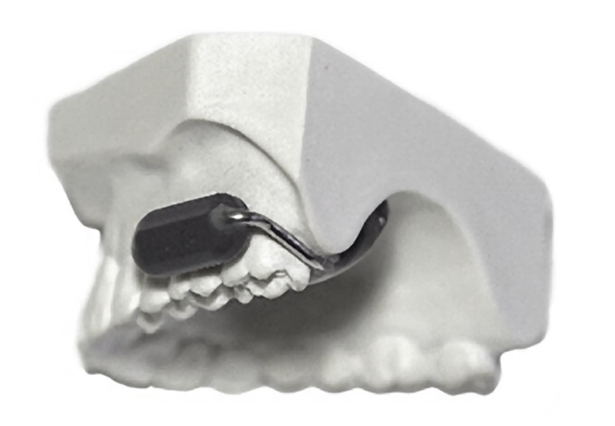 This new wireless communication device fits on your teeth