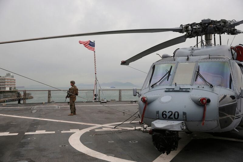 A U.S. marine patrols on the deck of the Blue Ridge, the 7th Fleet flagship, during a port call in Hong Kong on Saturday. (Kin Cheung/AP)