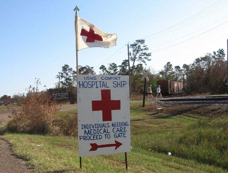 A makeshift sign made by USNS Comfort mariners pointed the way to the ship for medical care for local residents in Pascagoula, Mississippi after Hurricane Katrina. (Gillian Brigham)