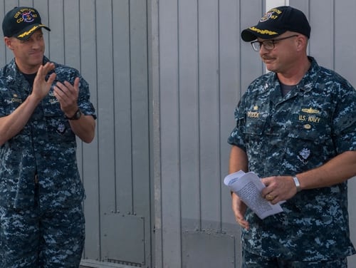 Capt. Adam M. Aycock, right, bids farewell to Shiloh sailors at his change-of-command ceremony in 2017. (Navy)