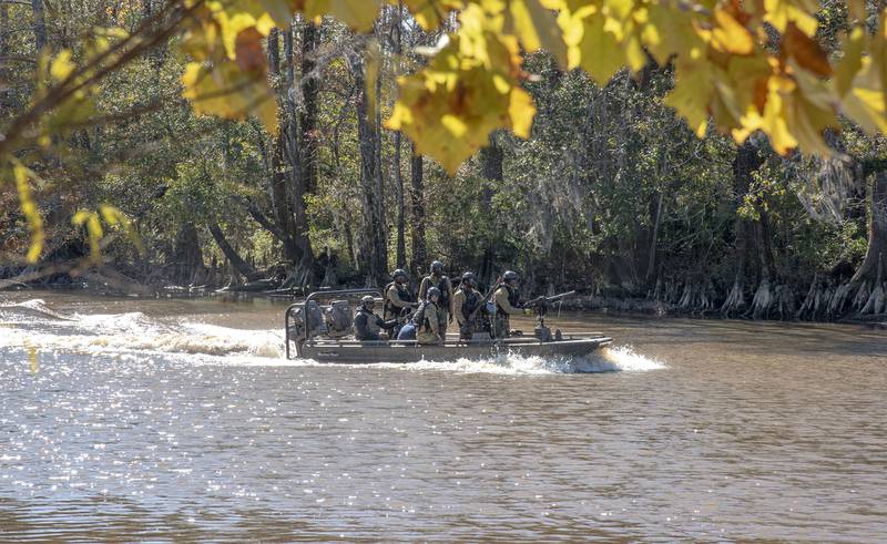 Naval Small Craft Instruction and Technical Training School students from Africa Command participate in a Patrol Craft Officer Riverine training exercise on the Pearl River near the John C. Stennis Space Center in Mississippi, Dec. 2, 2020.