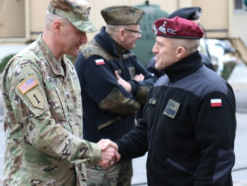 Col. Patrick Michaelis, commander of the Mission Command Element in Poznan, Poland, left, shakes hands with Maj. Gen. Adam Joks, deputy chief of the General Staff of the Polish armed forces, at the MCE Feb. 14, 2019. (Spc. Christina Westover/Army)