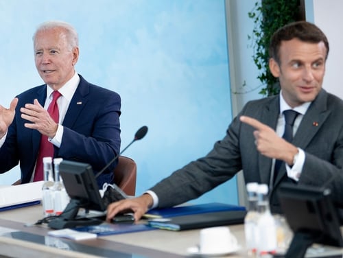 U.S. President Joe Biden, left, listens as French President Emmanuel Macron speaks at a working session during the G-7 summit in Carbis Bay, Cornwall, on June 12, 2021. (Brendan Smialowski/AFP via Getty Images)