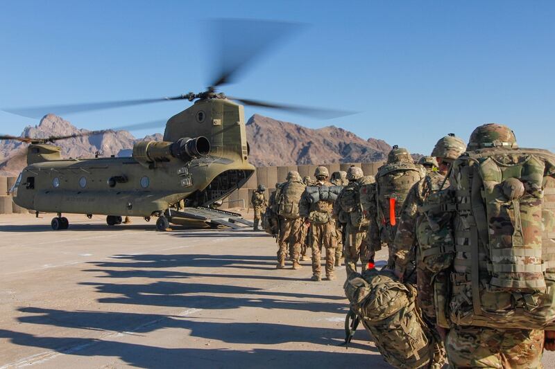 Soldiers with Resolute Support Mission load onto a Chinook helicopter during missions in Afghanistan. (Army)