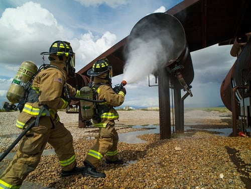 Ffirefighters extinguish a simulated No. 3 engine fire during capability demonstration of the P-34 Rapid Intervention Vehicle at Holloman Air Force Base, N.M., Sept. 21, 2014. (Airman 1st Class Aaron Montoya/Air Force)
