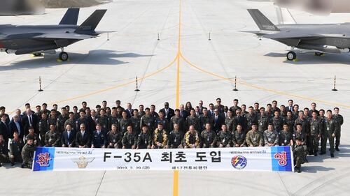 U.S and South Korean soldiers pose with two F-35A fighter jets at Chungju Air Base on March 29, 2019, in Chungju, South Korea. (PSouth Korean Defense Acquisition Program Administration via Getty Images)